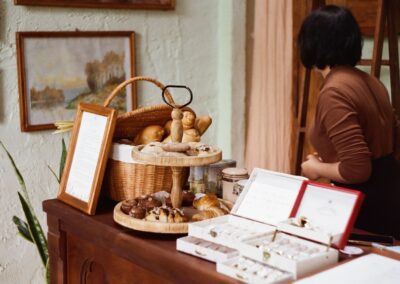 Warm café atmosphere showcasing a variety of fresh pastries and desserts on display.