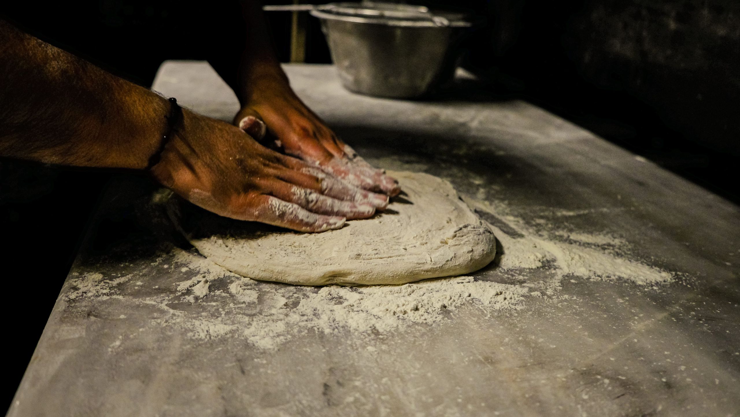 Hands kneading dough